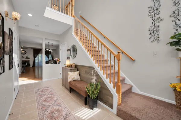 Living room with hardwood floors and staircase