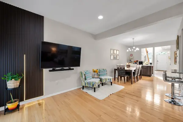 Living room with accent wall and mounted TV