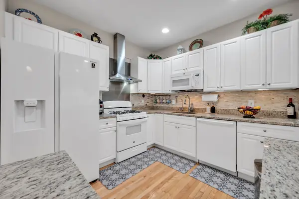 Renovated kitchen with granite countertops