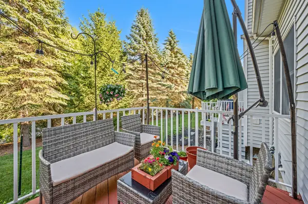 Private deck overlooking a tree-lined backdrop